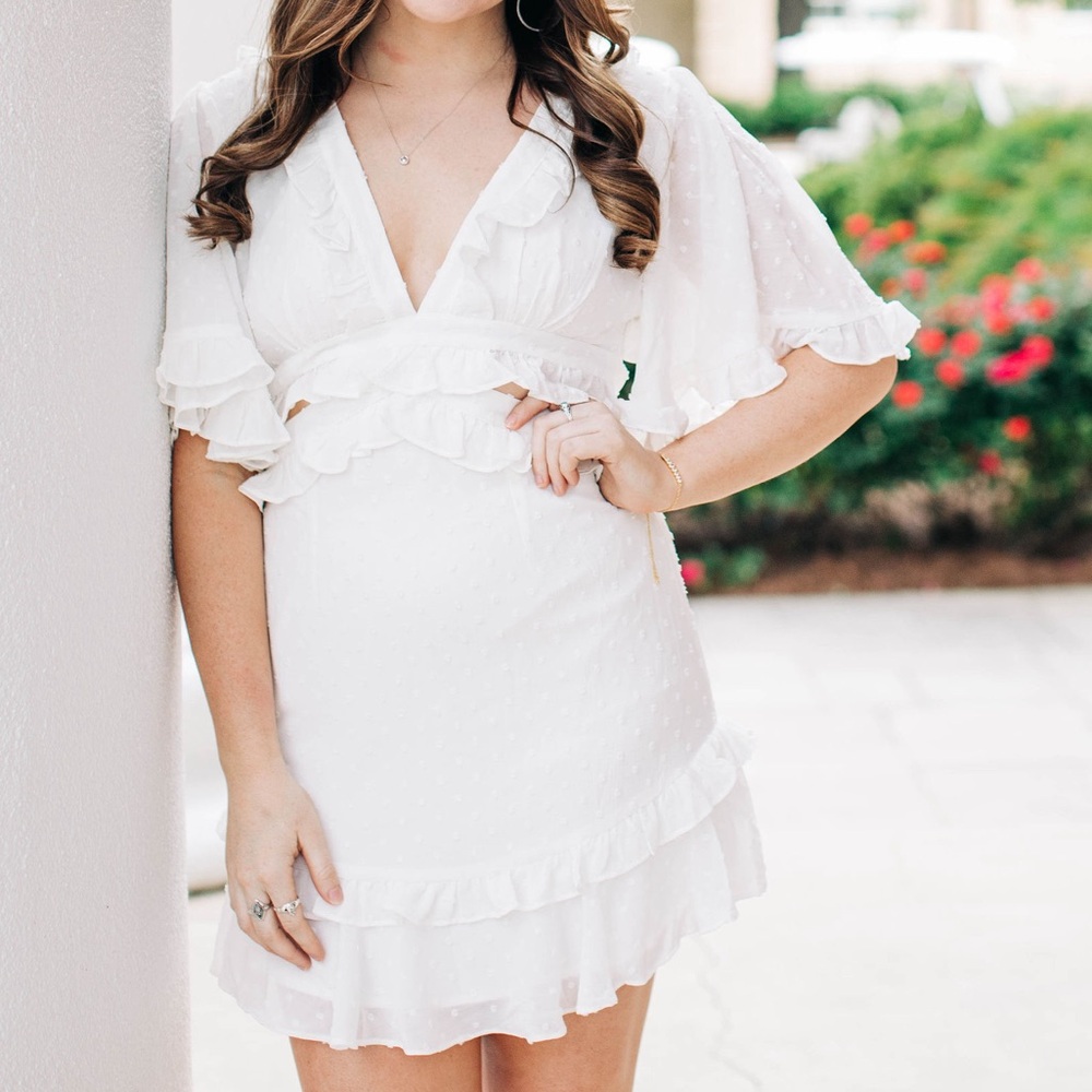 White cutout dress. Selfie Leslie.